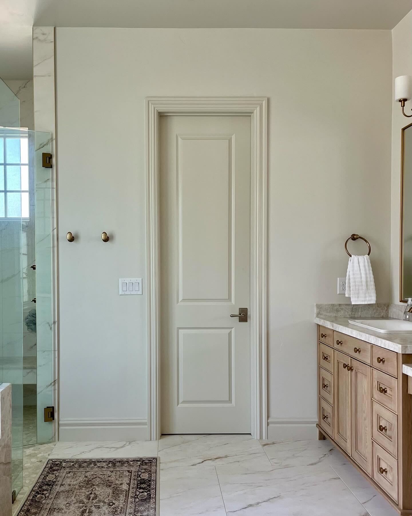 My bathroom featuring walls, ceiling, and trim in matching neutral tones, using subtle saturation differences.