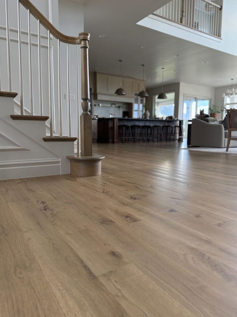Close-up of our white oak hardwood floors with rustic beige stain