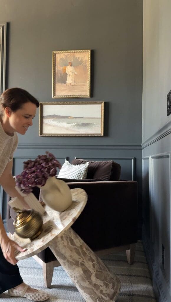 Tipping over a marble side table to show museum gel keeping decor items in place