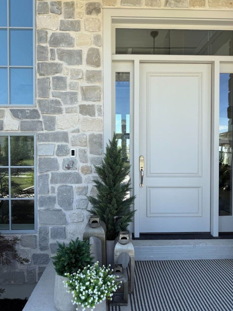 My front door, surrounded by gray natural stone.
