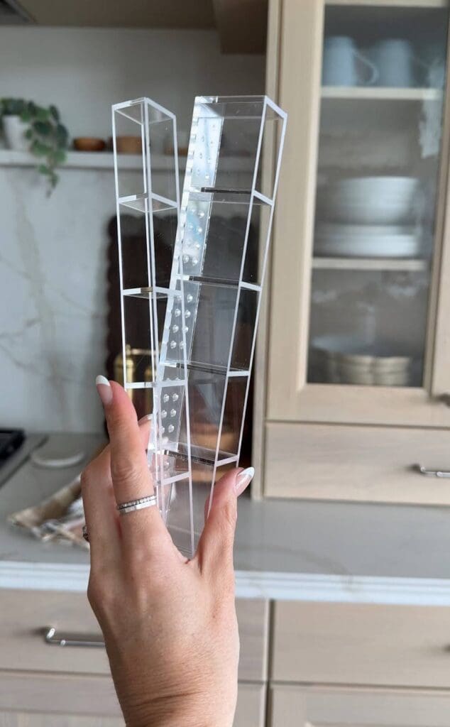 Close-up of the acrylic Amazon straw organizer held in hand