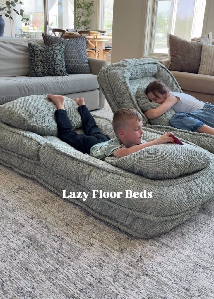Two children lounging on cozy, adjustable floor beds