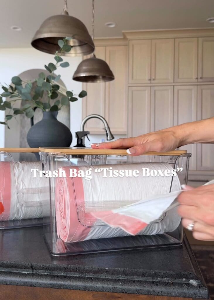 Clear container with rolled trash bags dispensing like tissues