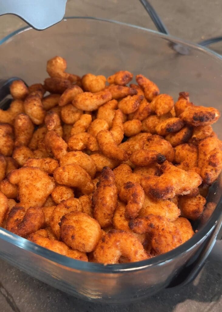 Close-up of golden brown crispy popcorn shrimp cooked in the Ninja CRISPi